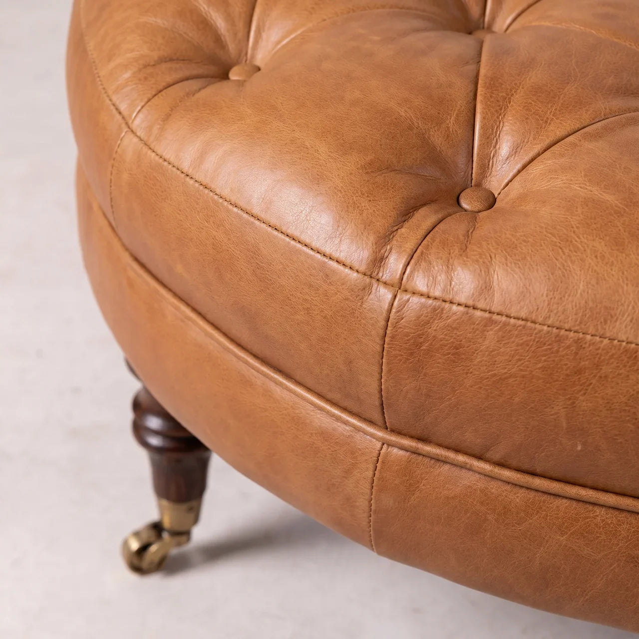 Brown Buffalo Leather Round Ottoman with Castor Legs