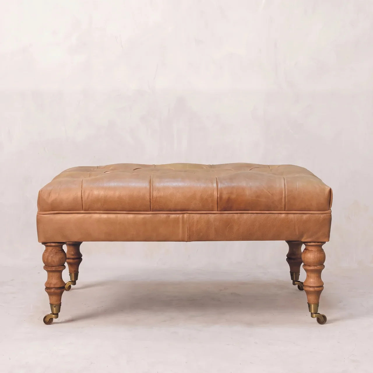 Tan Buffalo Leather Ottoman with Castor Legs — Solid Mango Wood