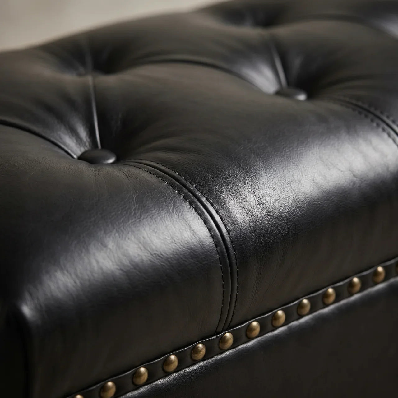 Black Leather Upholstered Ottoman