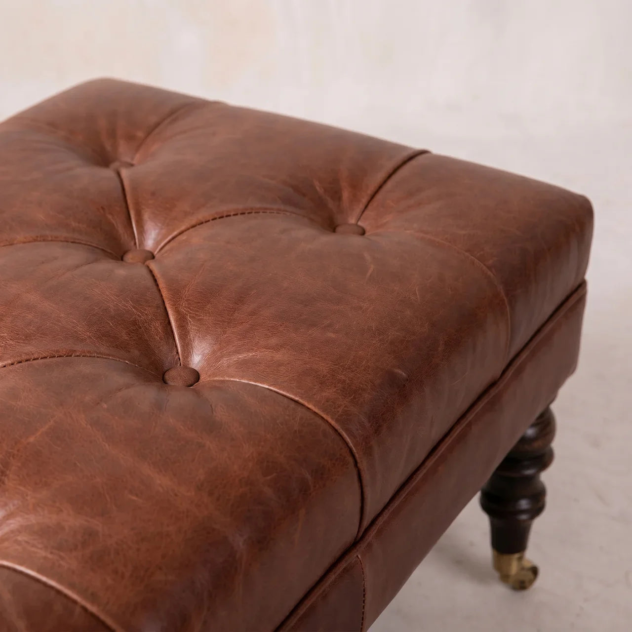 Buffalo Brown Leather Ottoman with Castor Legs