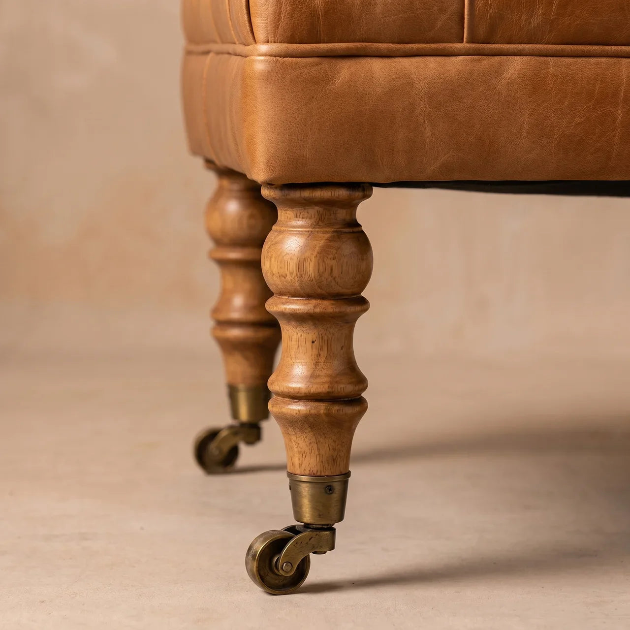 Tan Buffalo Leather Ottoman with Castor Legs — Solid Mango Wood